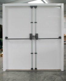 BR20 double doorset fitted with heavy duty shoot bolt to fixed leaf and heavy duty panic bar with three locking points.